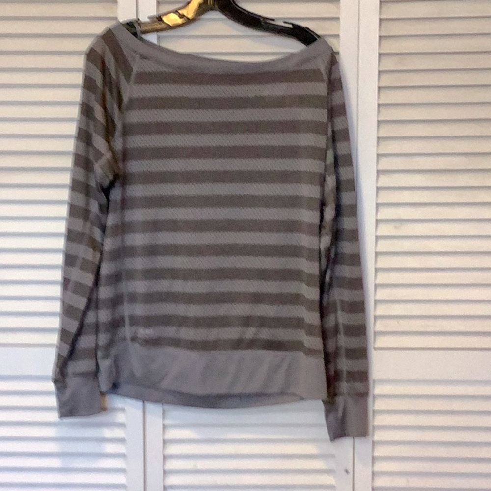 Woman’s Nike dry fit top dark and light grey stripes